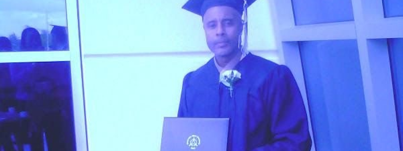 A person holding a diploma